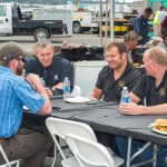 Paul Hoyer, Parts Consultant, (center) shared a light-hearted moment with customers.