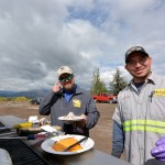 Jackson CRS Technician Enrique Rivera Lopez (left) grilled burgers and hot dogs to perfection.